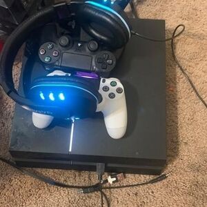 Sony PlayStation 4 Console with Black and White Controllers